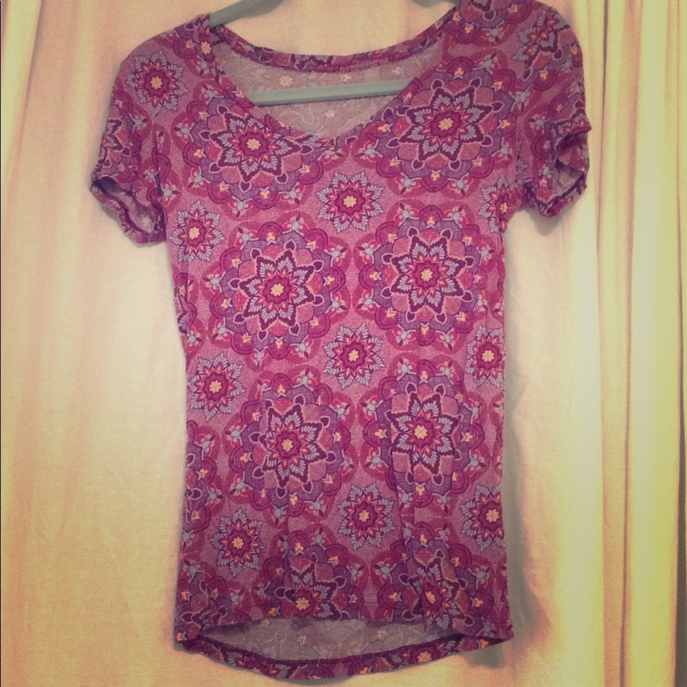 A maroon colored short-sleeved Shirt